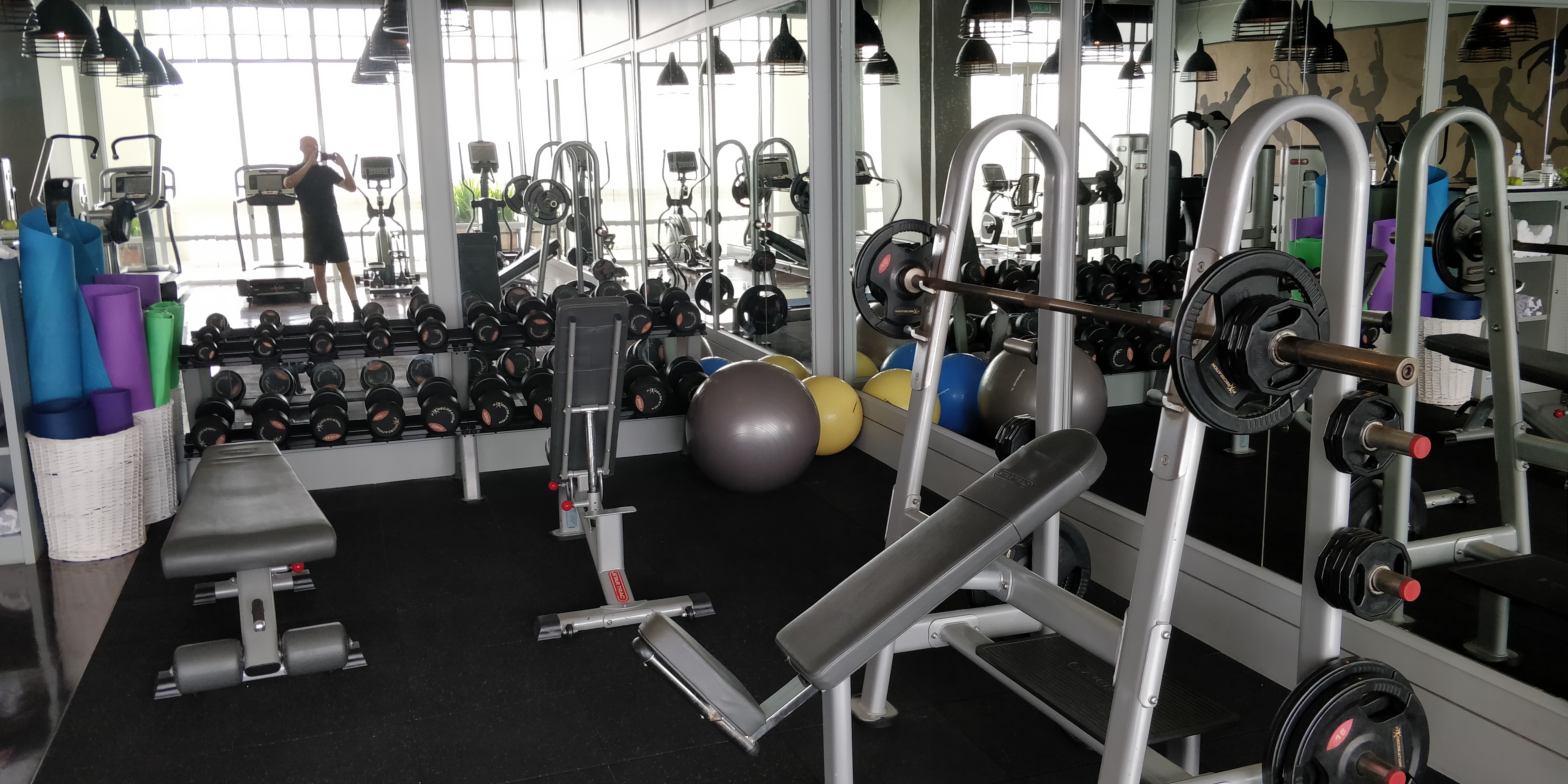 A PICTURE OF THE WEIGHT SECTION OF THE GYM