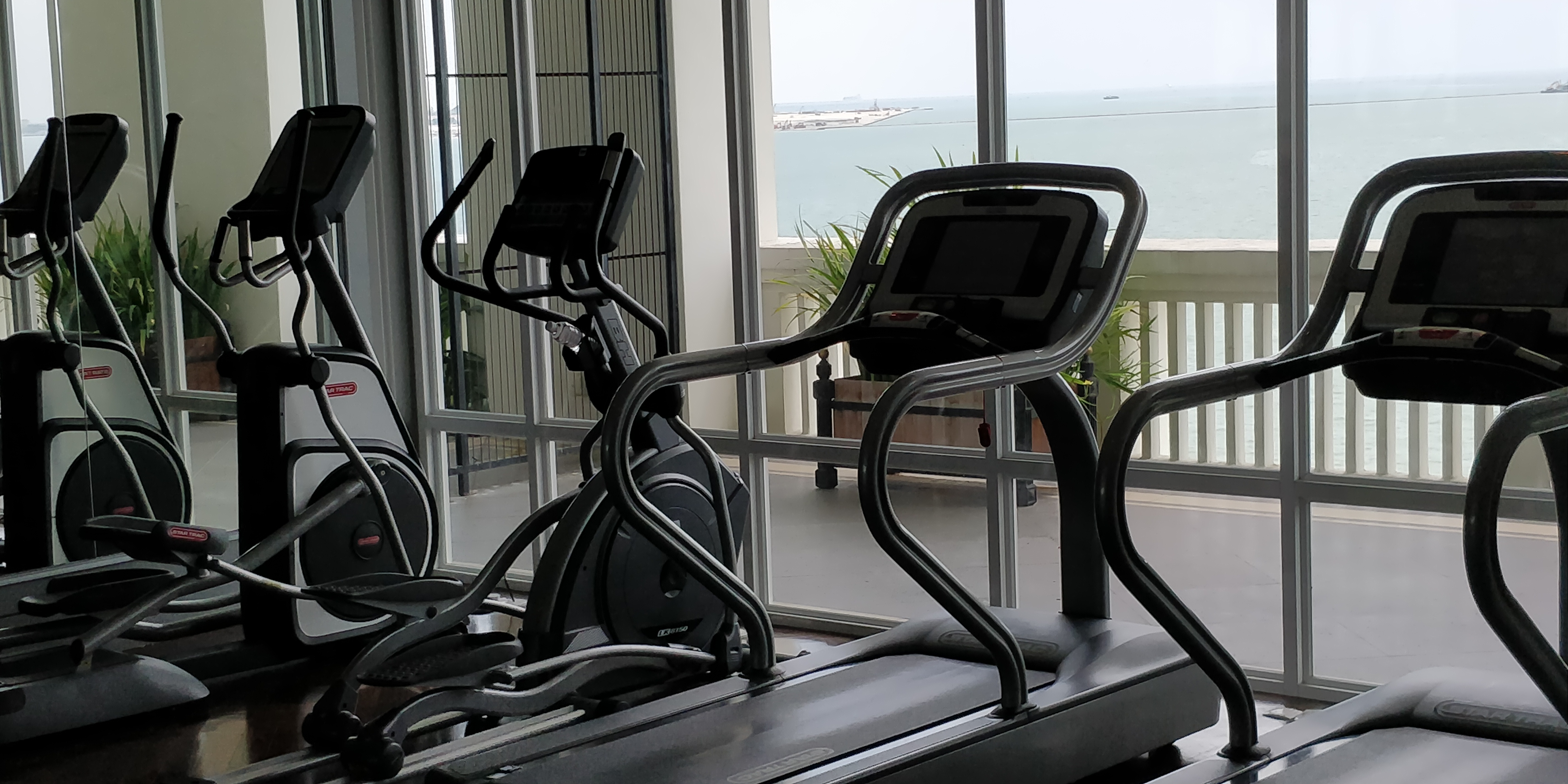 A PICTURE OF CARDIO EQUIPMENT OVERLOOKING THE SEA