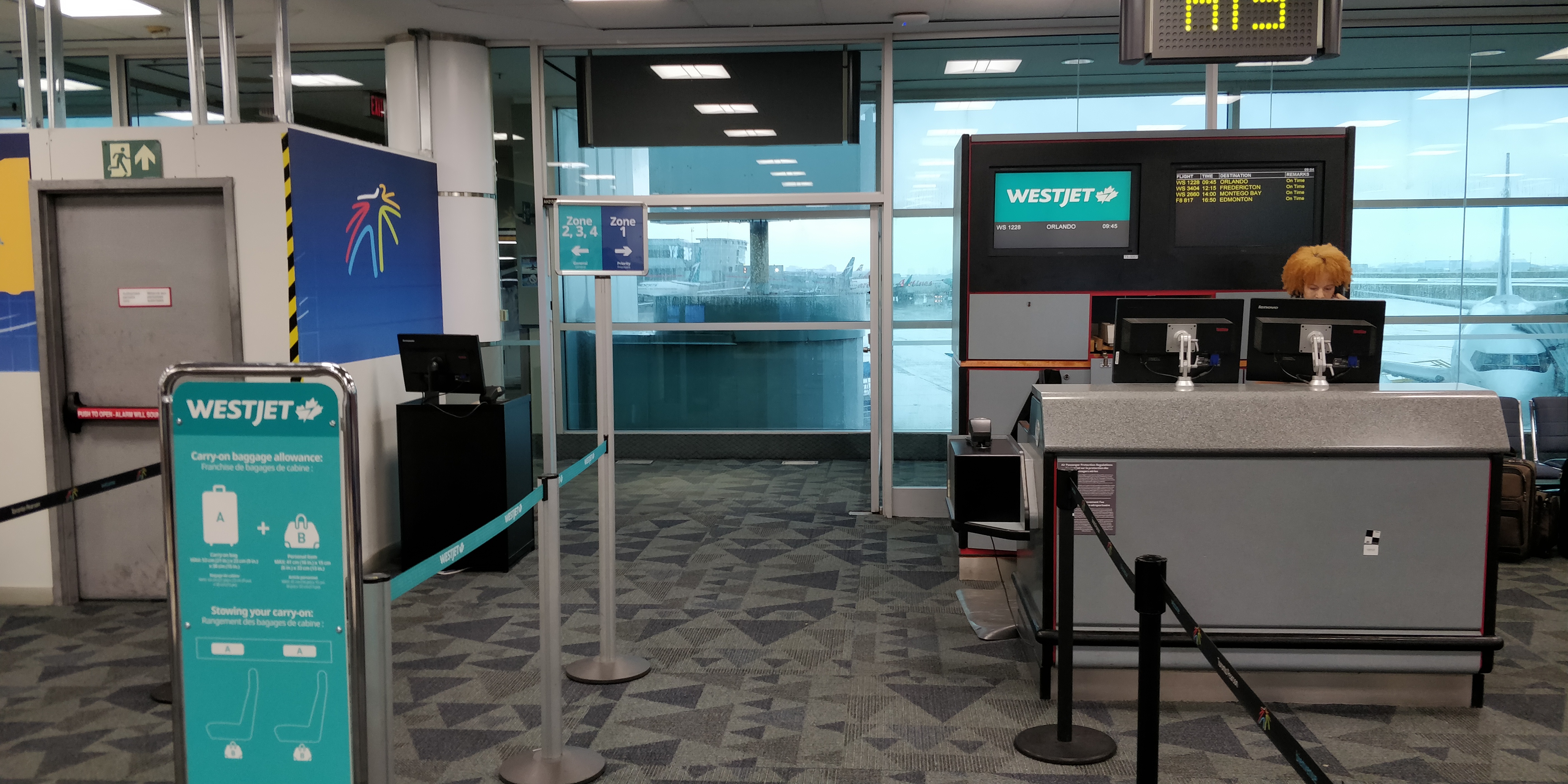 A PICTURE OF THE WESTJET BOARDING AREA WITH PRIORITY BOARDING