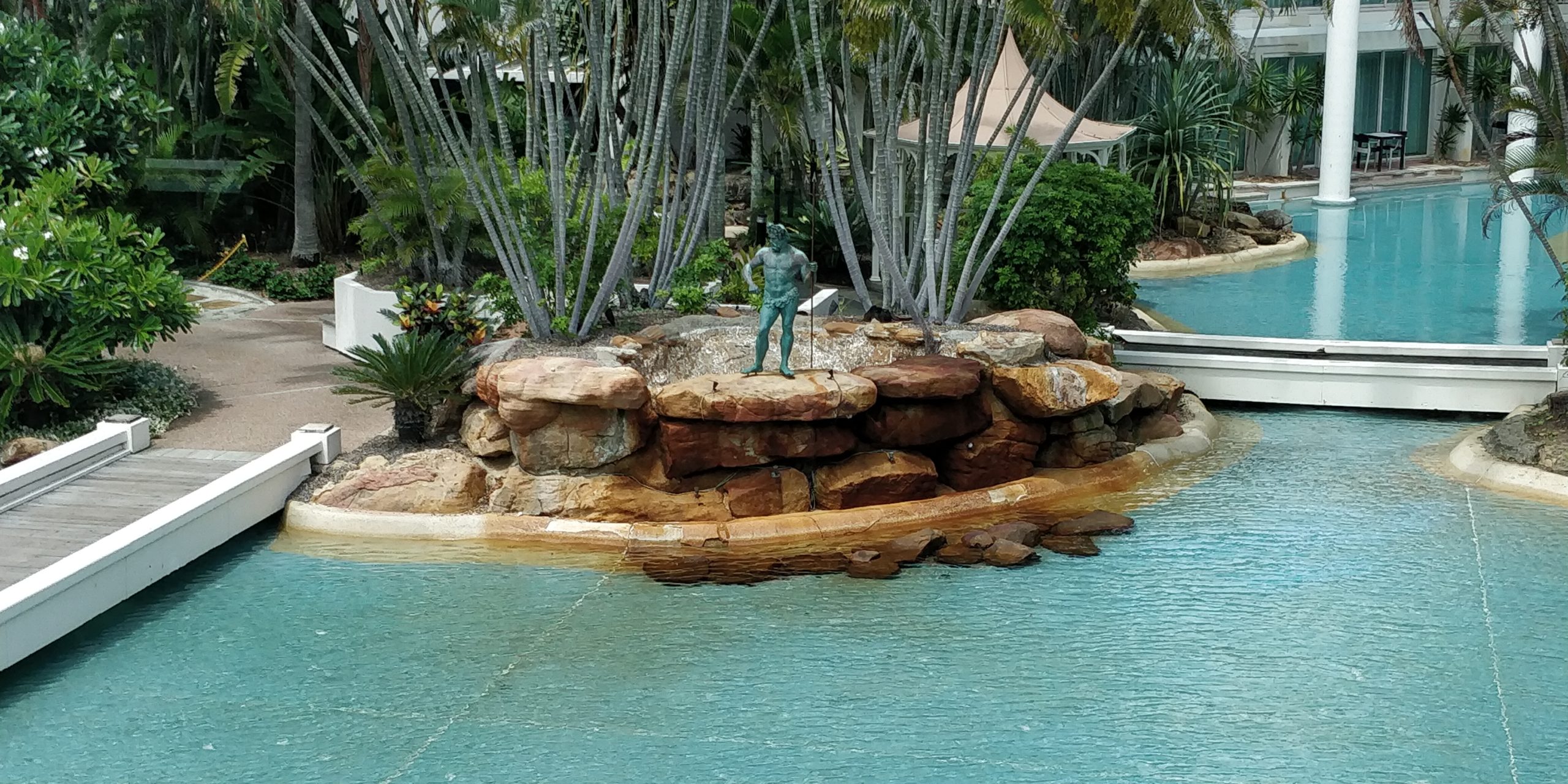 Review the Grand Mirage Resort picture of a statue of Poseidon in the lagoon
