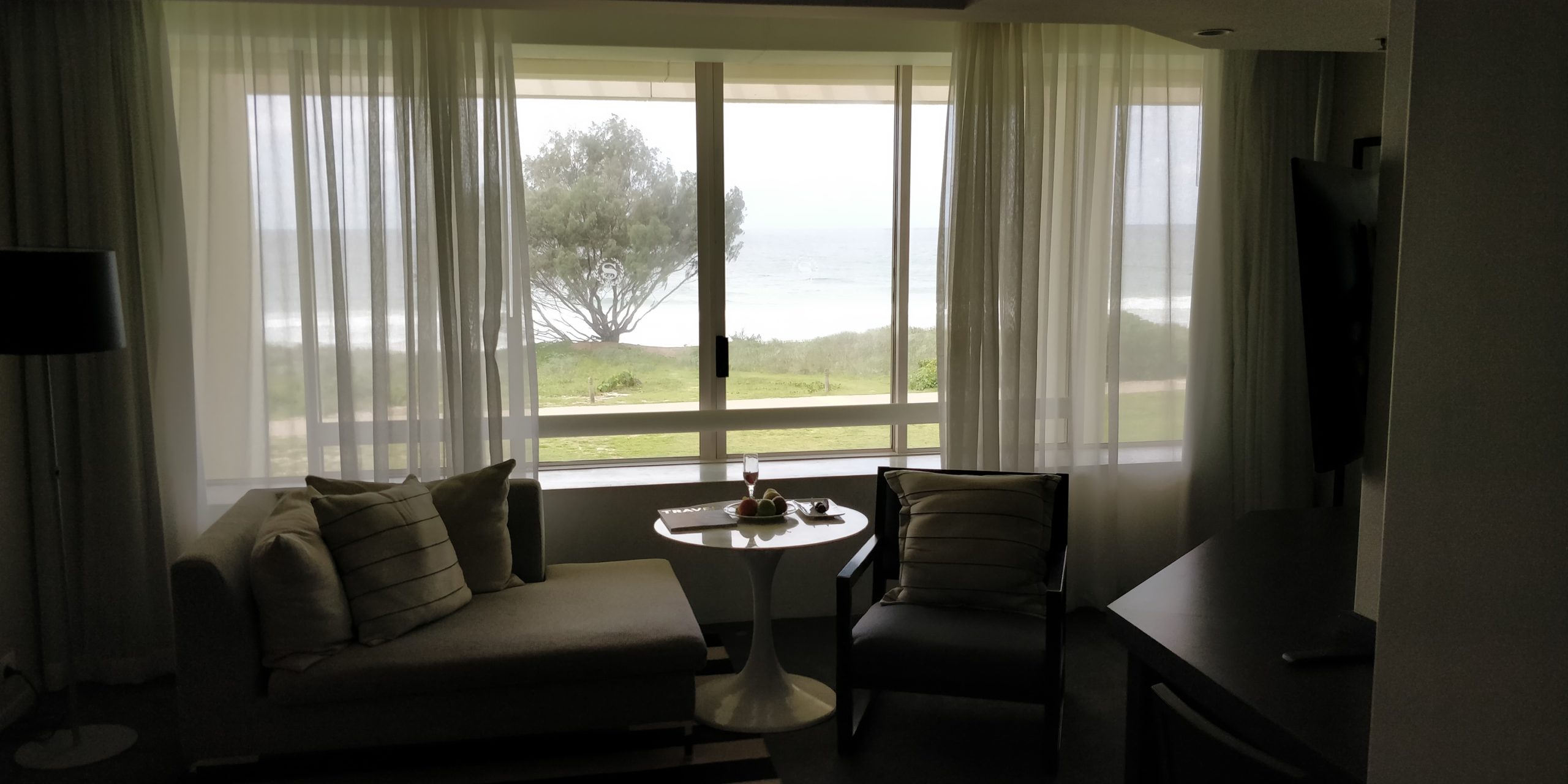 Review the Grand Mirage Resort picture of the seating and wide widow which opens to the ocean view