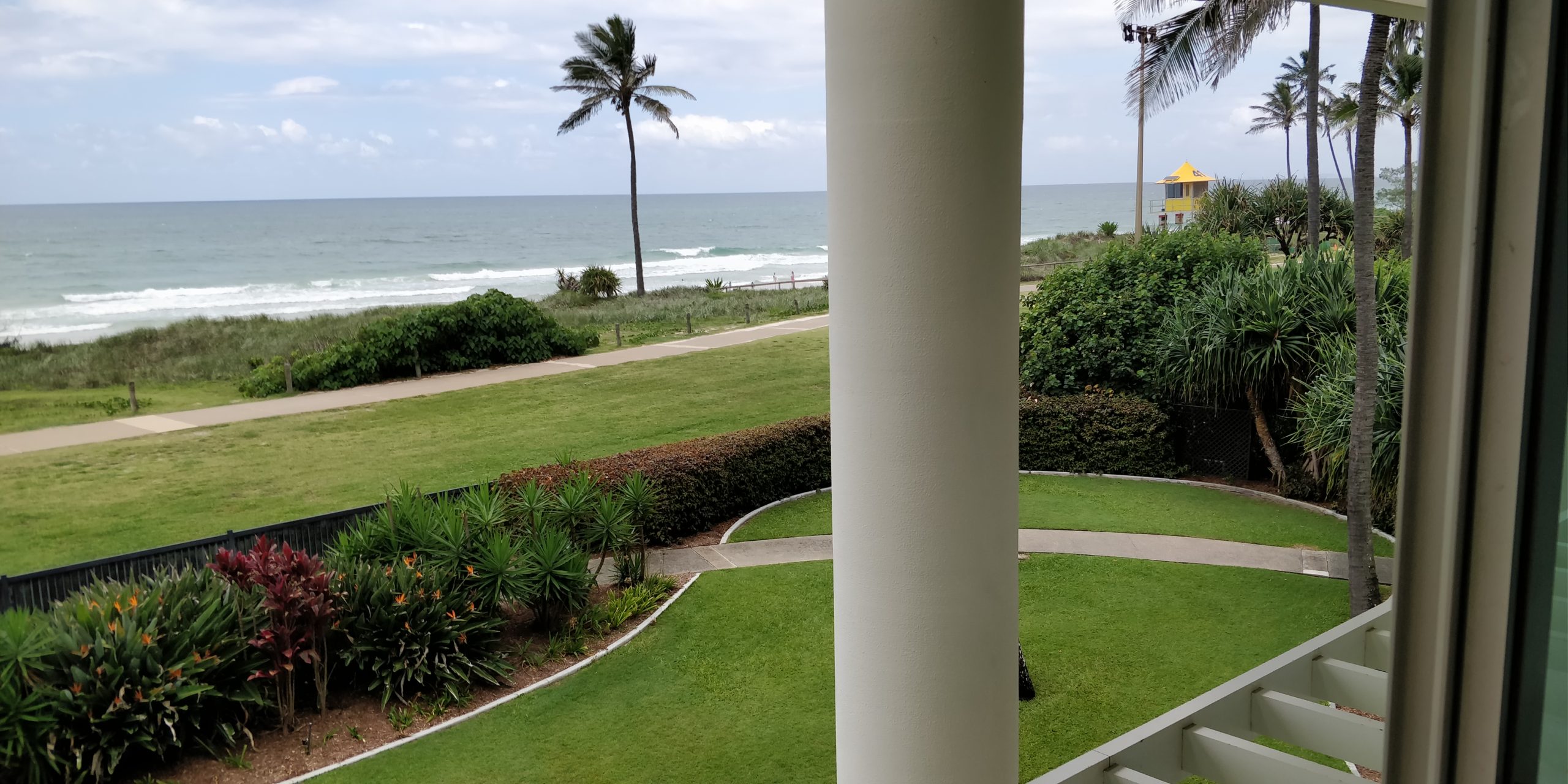 Review the Grand Mirage Resort picture of the view from the room window capturing the surf and life guard box