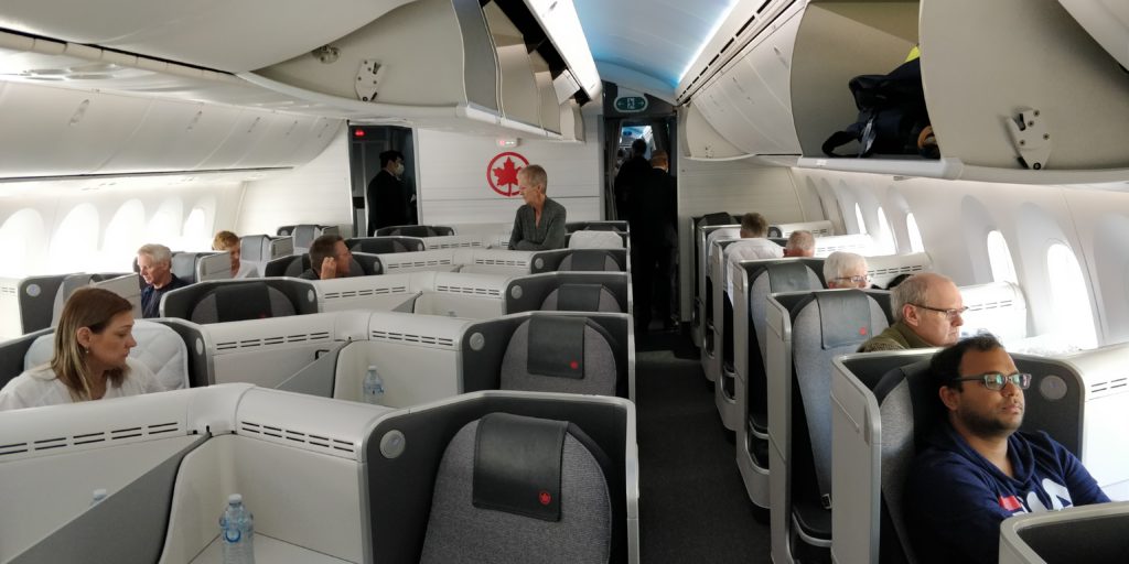 picture of the business class cabin on Air Canada 787-9 out of Sydney which was half empty while flying the coop.