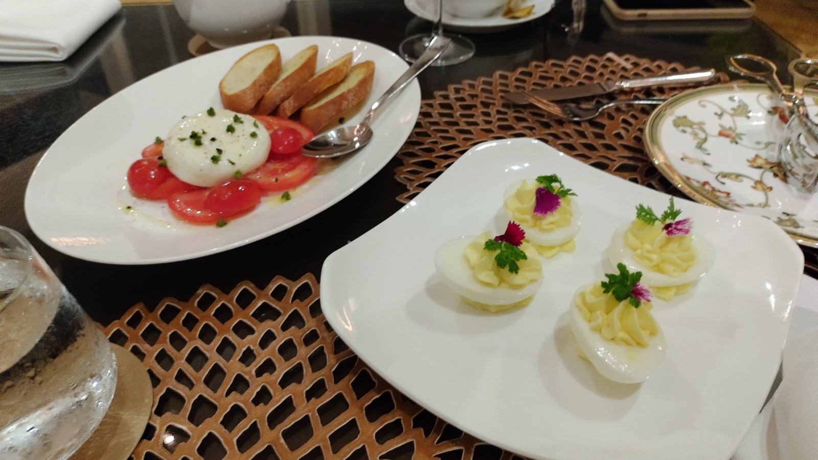 PICTURE OF THE DEVILED EGGS AND TOMATO AND BURATA