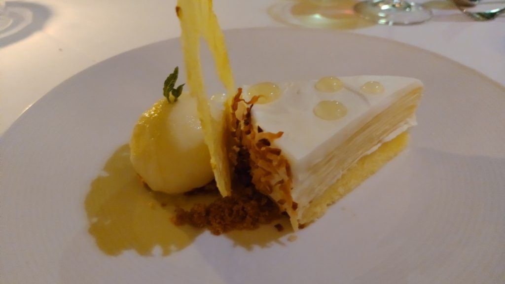 PICTURE OF THE HAUPIA PINEAPPLE CREPE CAKE WITH PINEAPPLE SORBET SIDE.