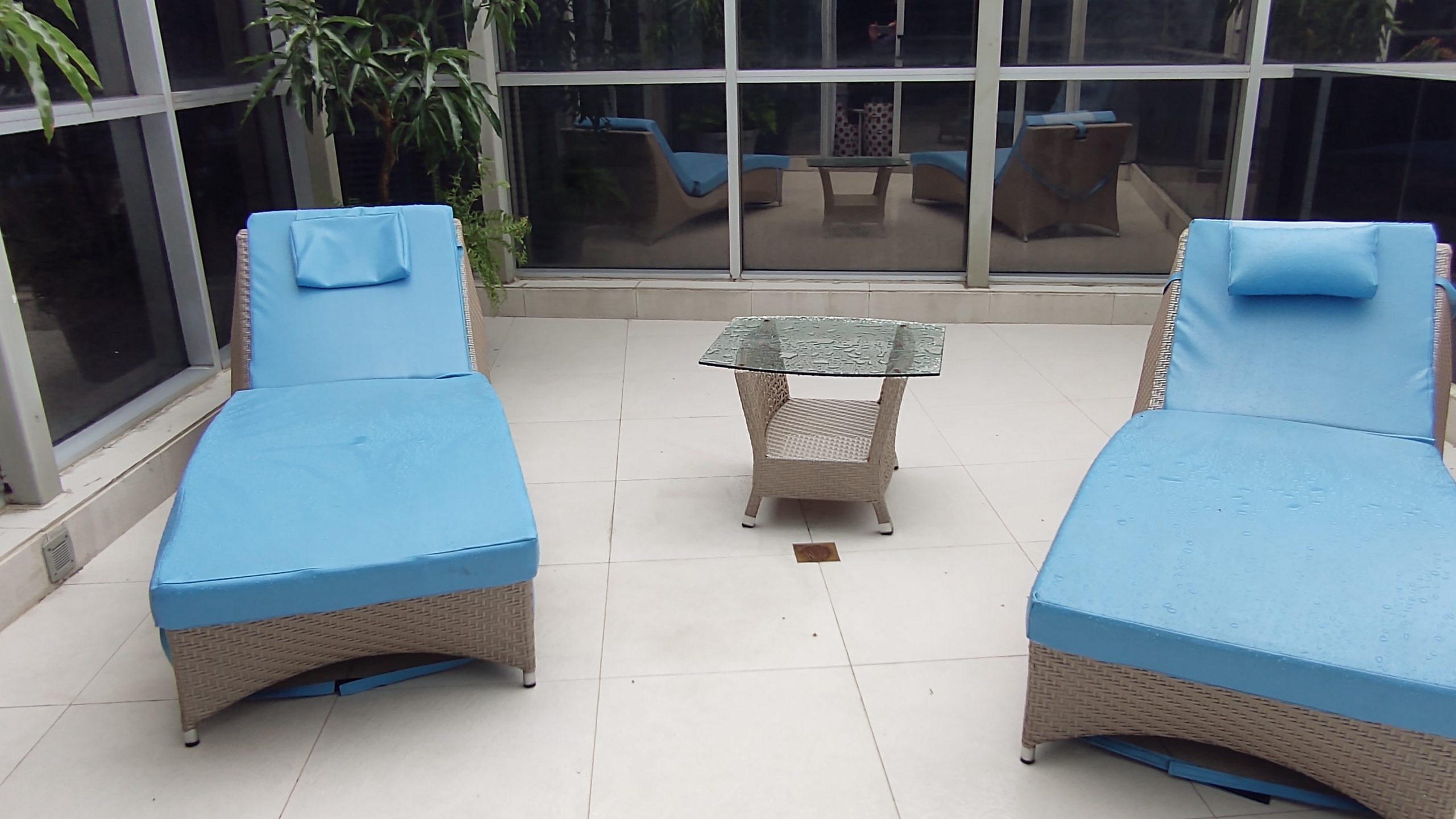 picture of the chairs and table on the patio deck of the room.