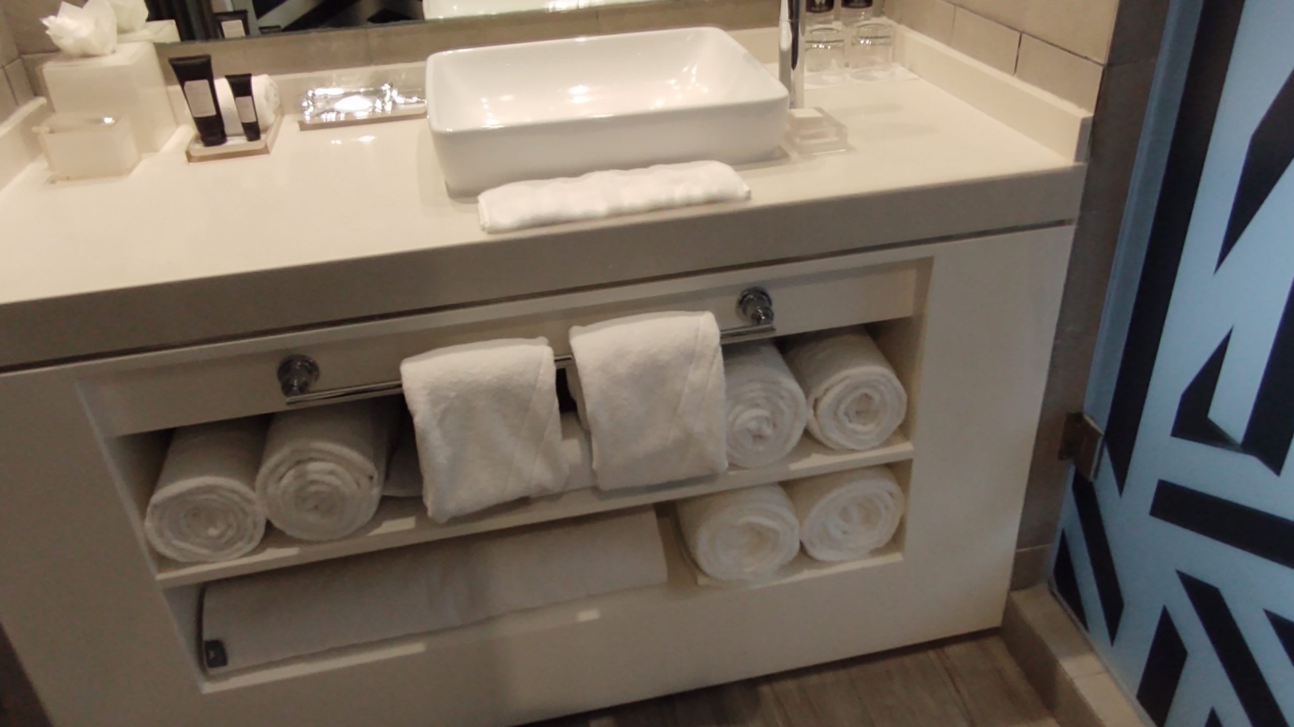 picture of the towel rack by the bathroom sink.