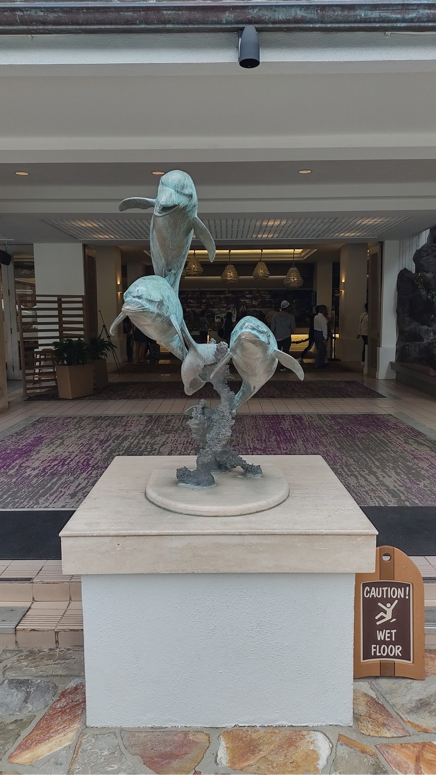 picture of the dolphins statue at the front of the hotel entrance.