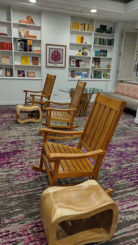PICTURE OF THE ROCKING CHAIRS IN THE LIBRARY SECTION OF THE LOBBY.