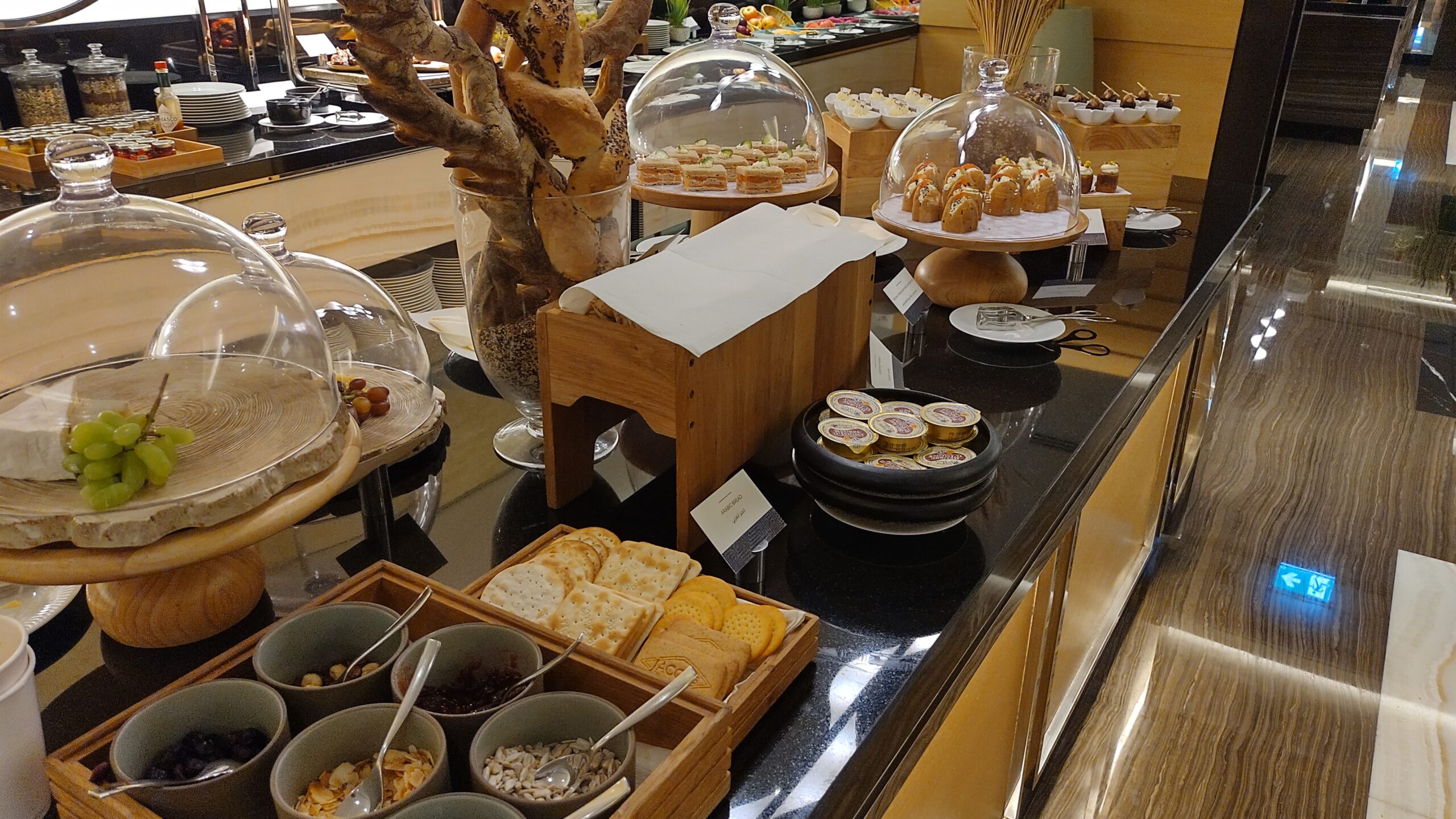 PICTURE OF THE FRESH BREAD AND CONDIMENTS STATION.