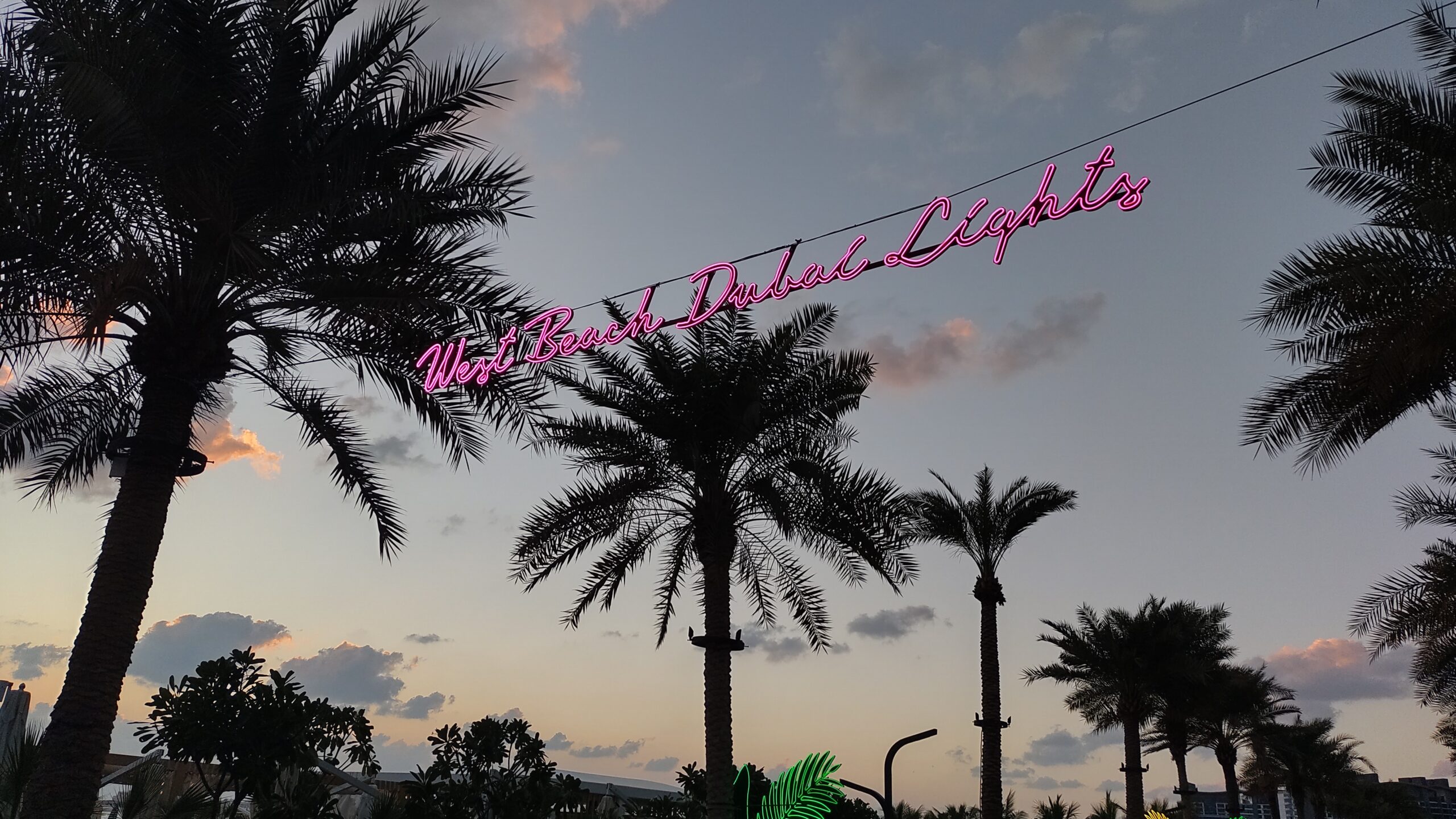 PICTURE OF THE WEST BEACH DUBAI LIGHTS SIGN IN THE EVENING.