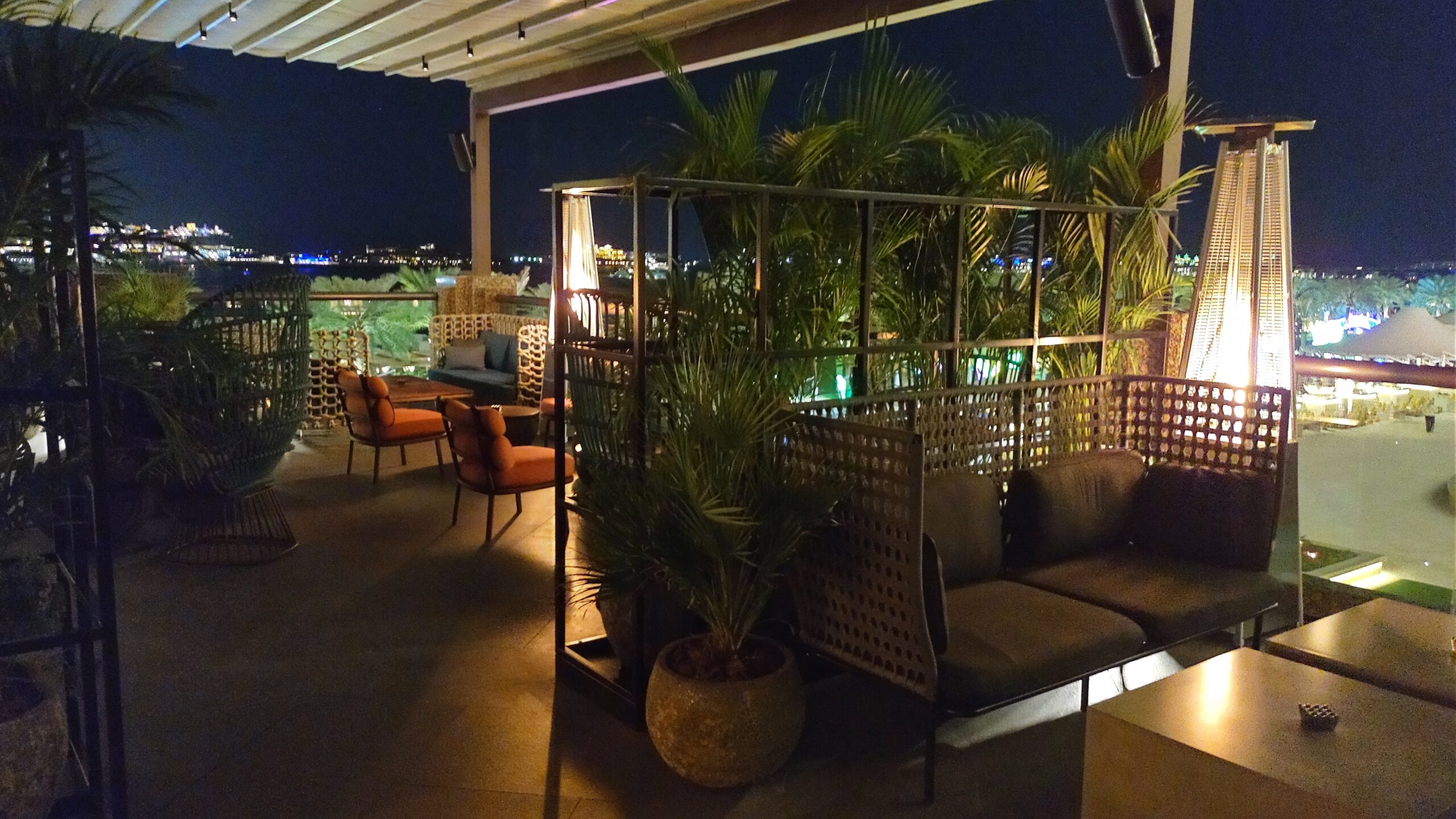 PICTURE OF THE OUTDOOR SEATING AREA OVERLOOKING THE BOARDWALK AND HARBOUR