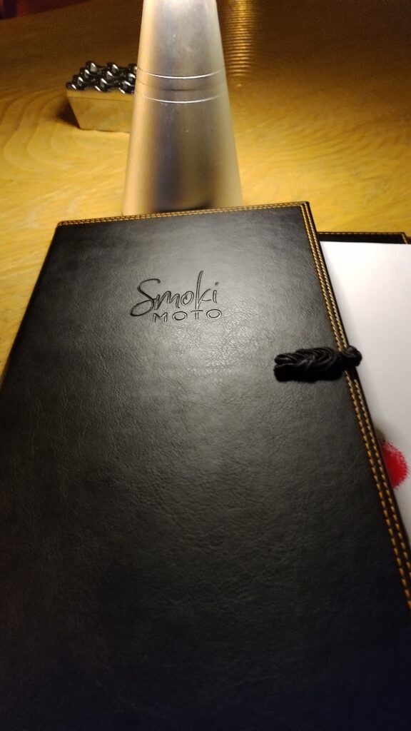 PICTURE OF THE LEATHER COVER OF THE MENU.