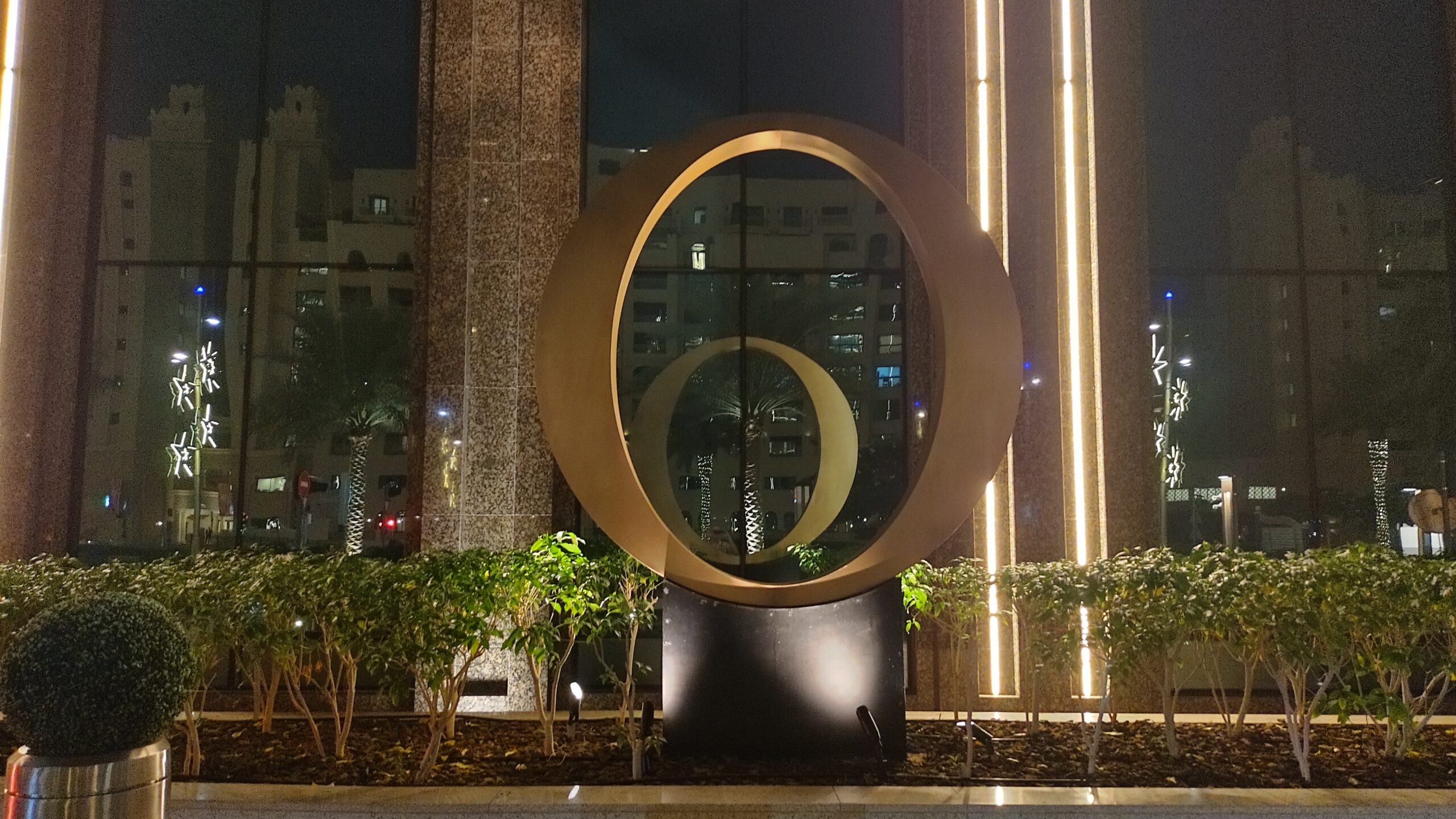 A PICTURE OF THE BIG GOLD "O" OUT FRONT OF THE HOTEL AND THE OKKU RESTAURANT.