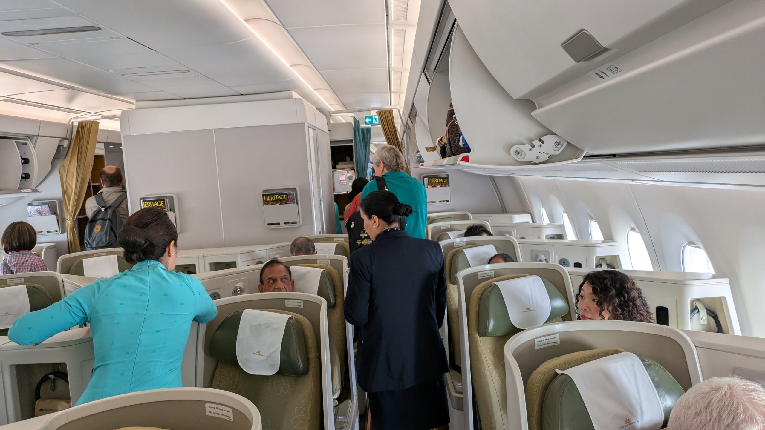 PICTURE OF THE PASSENGERS BOARDING THE FLIGHT AHEAD OF ME.