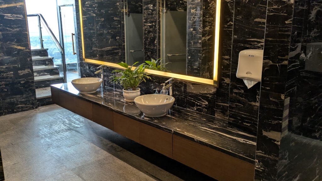 PICTURE OF THE ENTRANCE OF THE SPA LEADING TO THE SINKS AND WASH UP AREA.