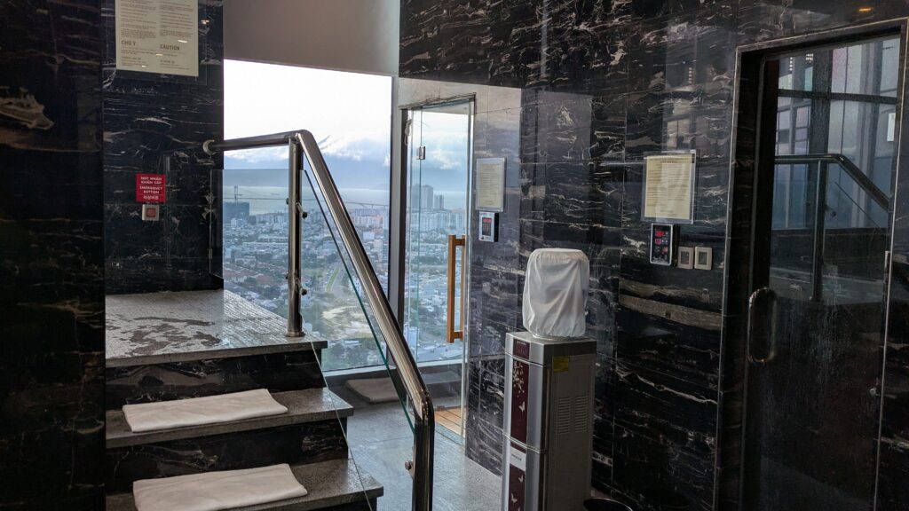 PICTURE OF THE STEAM, SAUNA, AND STEPS LEADING UP TO THE JACUZZI.