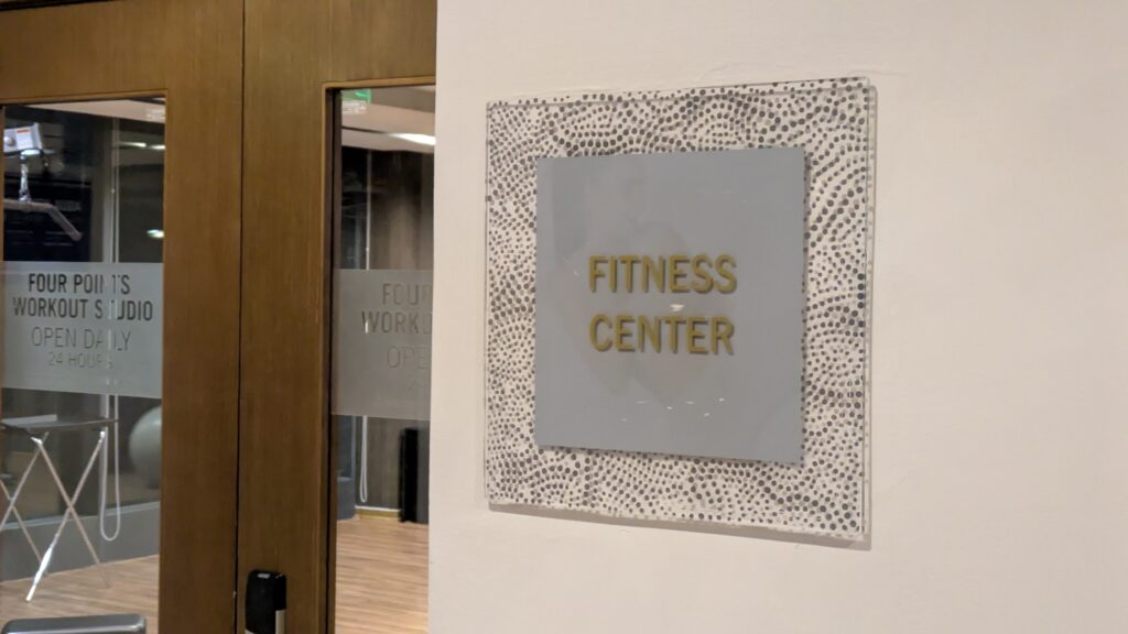 PICTURE OF THE FITNESS CENTER SIGN  AT THE ENTRANCE TO THE GYM.