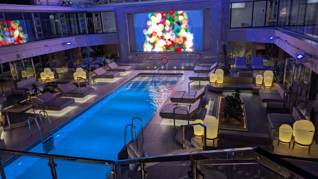 PICTURE OF THE FORWARD MAIN POOL WHICH HAS A BIG SCREEN TV AND CONVERTIBLE ROOF.